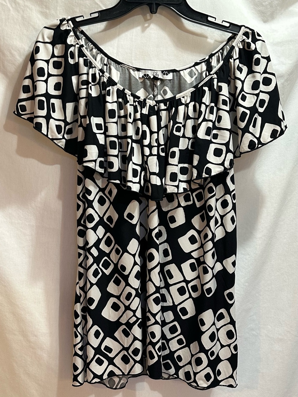 Lily Black & White Geometric Off-Shoulder Top with all around ruffle.